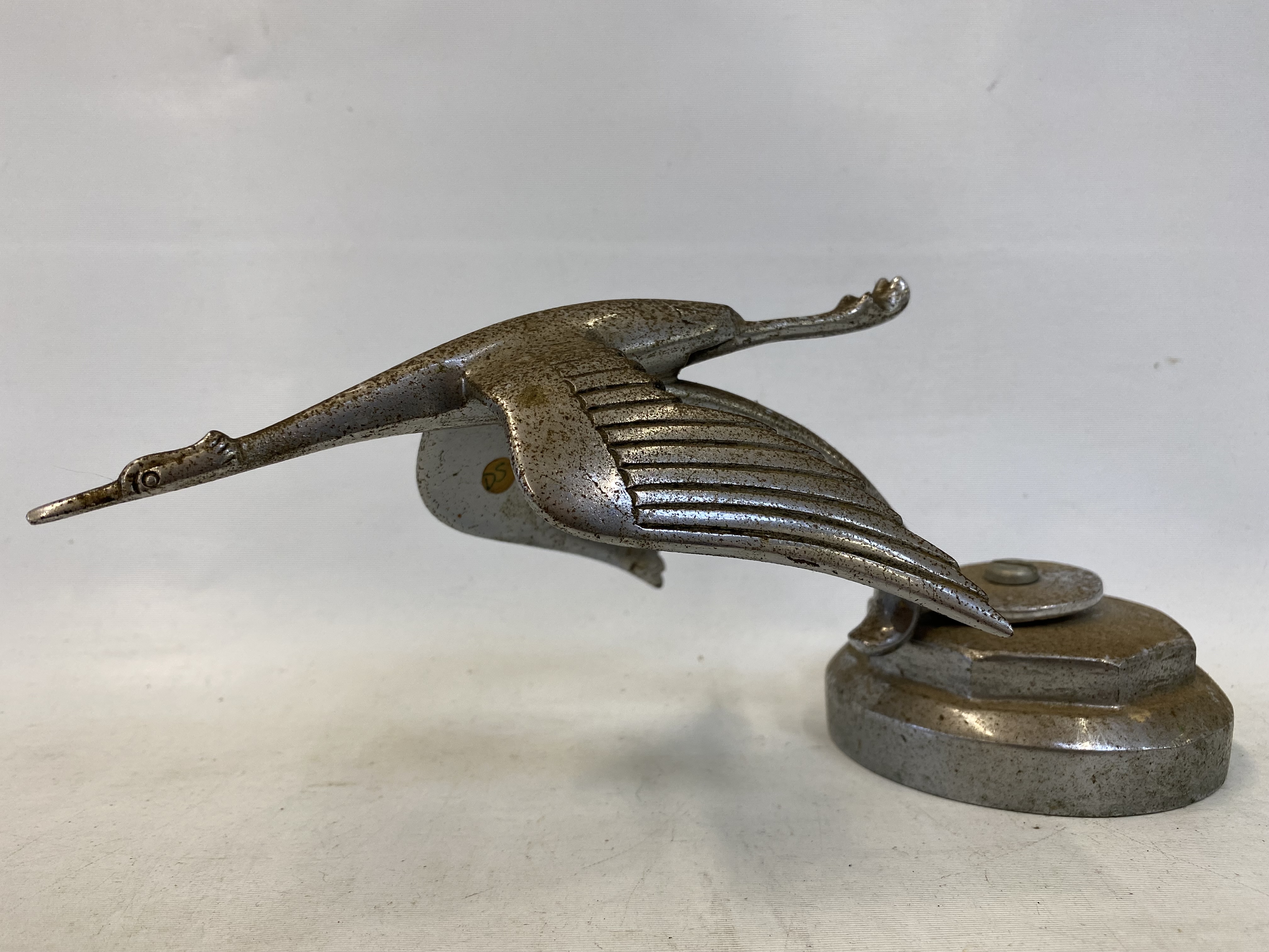 A flying stork accessory mascot as fitted to Hispano Suiza cars, radiator cap mounted.