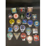 A tray of mixed car badges.