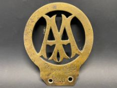 An AA Stenson Cooke brass car badge, no. 210.