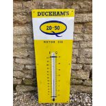 A Duckham's 20-50 Motor Oil enamel thermometer, 13 x 36".
