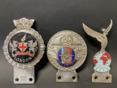 A Royal Air Force part enamel St. Christopher car badge, a Gaunt Regimental car badge and one other.