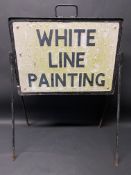 A road sign warning of White Line Painting, on a stand, 23" w.