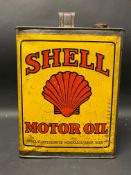A Continental Shell Motor Oil gallon can of bright colour.