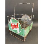 A Wakefield Castrol Motor Oil nine-division crate with two wrap-around enamel signs attached.