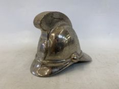 An accessory car mascot in the form of a fireman's helmet.