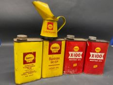 Two Shell X-100 quart oil cans, two yellow Shell cans and a Shell Lubricants half pint measure.