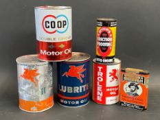 A selection of assorted oil cans including Mobil, Trolene etc.