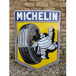 A very good large size Michelin pictorial enamel sign depicting Mr. Bibendum rolling a tyre, dated
