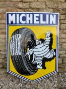 A very good large size Michelin pictorial enamel sign depicting Mr. Bibendum rolling a tyre, dated