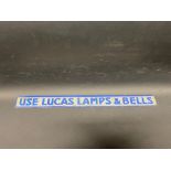 A Lucas Lamps & Bells shelf strip with raised lettering.