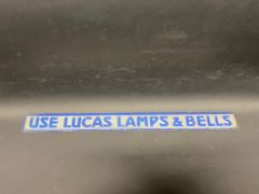 A Lucas Lamps & Bells shelf strip with raised lettering.
