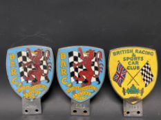 Two BARC enamel car badges no. 140 and 531 plus a British Racing and Sports Car badge.