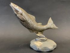 A Desmo accessory car mascot in the form of a leaping salmon, mounted on a radiator cap.