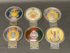 Six assorted Beaulah car badges.