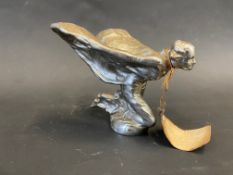 A Rolls-Royce Spirit of Ecstasy kneeling feather car mascot, signed C. Sykes and dated 1934.