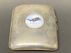 A Blue Bird Petrol silver plated cigarette case with good condition porcelain disc to the centre.