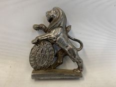 A Justice and Strength brass lion passant mascot.