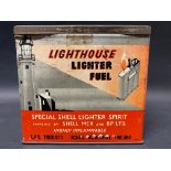 An unusual Shell Lighthouse Lighter Fuel rectangular tin with images all round of a lighthouse, in