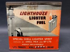 An unusual Shell Lighthouse Lighter Fuel rectangular tin with images all round of a lighthouse, in