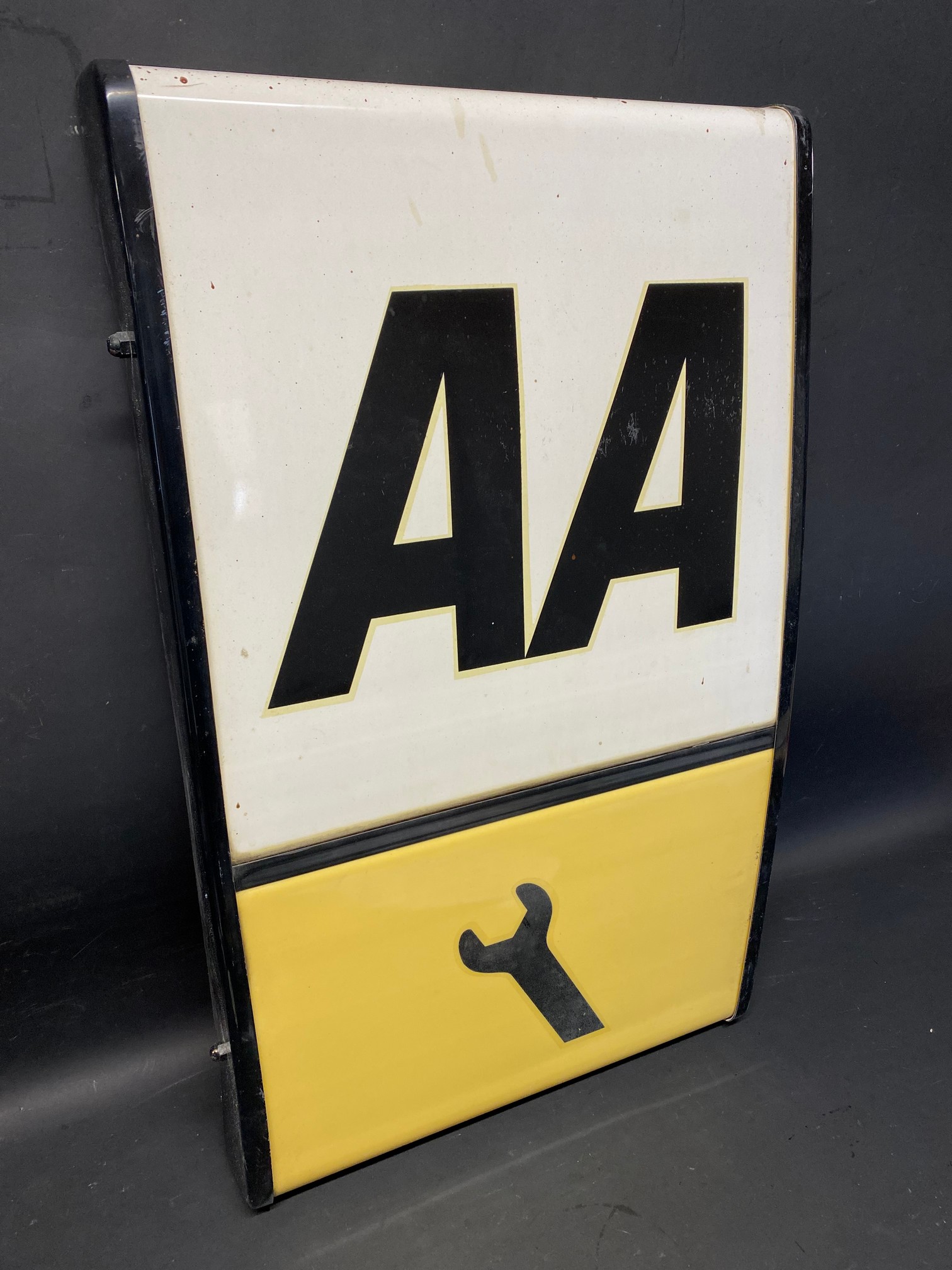 An AA illuminated lightbox lacking back panel, 16 x 27".