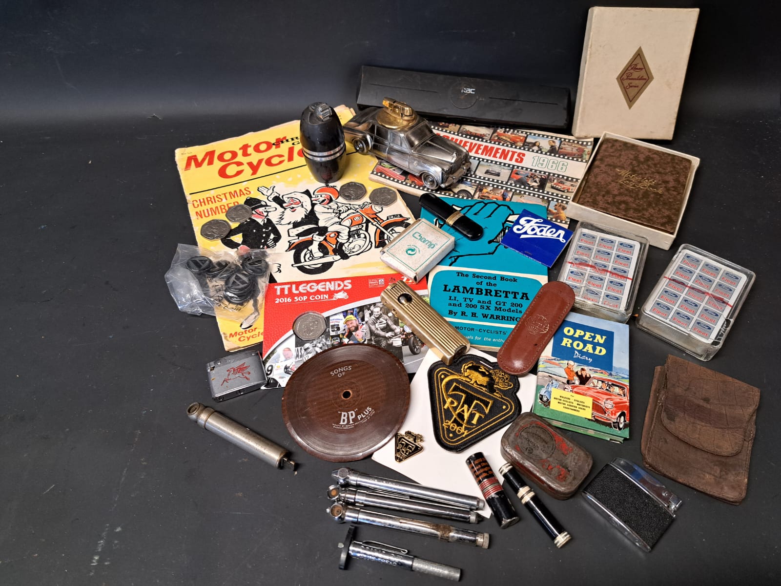 A tray of mixed motoring ephemera, collectables etc. including lighters, playing cards etc.