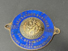 A blue enamel dash plaque for Alexander & Garner, Deansgate, Manchester.