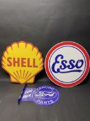 Three contemporary tin advertising signs including Shell.