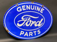 A Ford Genuine Parts oval double sided enamel sign stamped: Property of Ford Motor Co., made in USA,