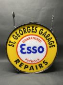 An original circular hanging lightbox now fitted with perspex panels advertising St. Georges