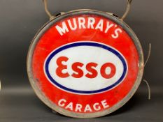 An Esso illuminated circular garage lightbox advertising Murray's Garage, in very original