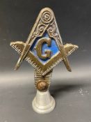 An unusual Masonic car badge bearing the letter G, display base mounted.