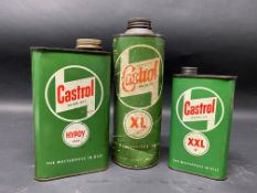 A Wakefield Castrol Motor Oil XL grade cylindrical cardboard quart can plus a Castrol Motor Oil '