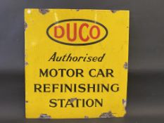 A rectangular enamel sign advertising a Duco Authorised Motor Car Refinishing Station, 25 1/2 x