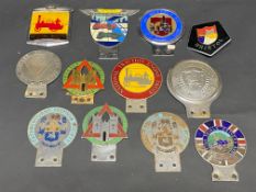 A tray of assorted car badges including National Traction Engine Trust, Swansea Motorist's League,