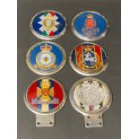 Six assorted regimental car badges including the Wiltshire Regiment.