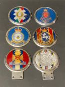 Six assorted regimental car badges including the Wiltshire Regiment.