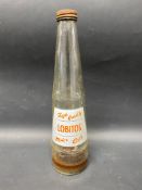 A Lobitos Motor Oils conical glass oil bottle.