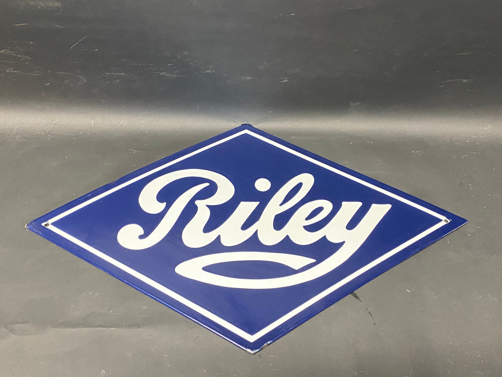 A reproduction Riley lozenge shaped enamel sign, 20 1/2 x 12".