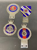A selection of J.R. Gaunt and other car badges including Royal Military Police.