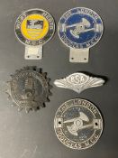 A small group of badges, all motor cycling related including Douglas and BSA.
