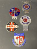 A selection of enamel car badges including Lancashire County Council Motor Driving Advisory Schools.