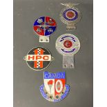 A selection of enamel car badges including Lancashire County Council Motor Driving Advisory Schools.