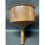 A large copper circular funnel.
