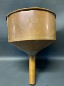 A large copper circular funnel.