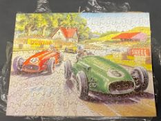 A wooden interlocking jigsaw puzzle depicting a 1950s motor race.