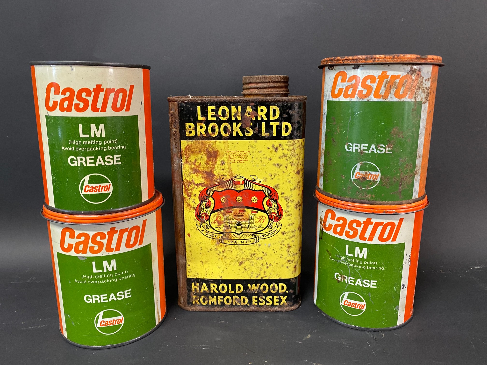 Four Castrol grease tins plus a Leonard Brooks Ltd quart can.