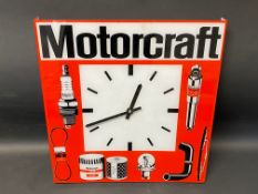 A Motorcraft plastic battery-operated garage wall clock, 15 x 15 3/4".