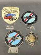 A 75 Years of Morgans car badge, two Morgan Sports Car Club badges and a Morgan Runabout St.