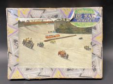 A Valentine's 40pc jigsaw puzzle of motor racing at Brooklands, complete in original box.