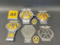 A tray of assorted AA badges, including lapel and commercial.